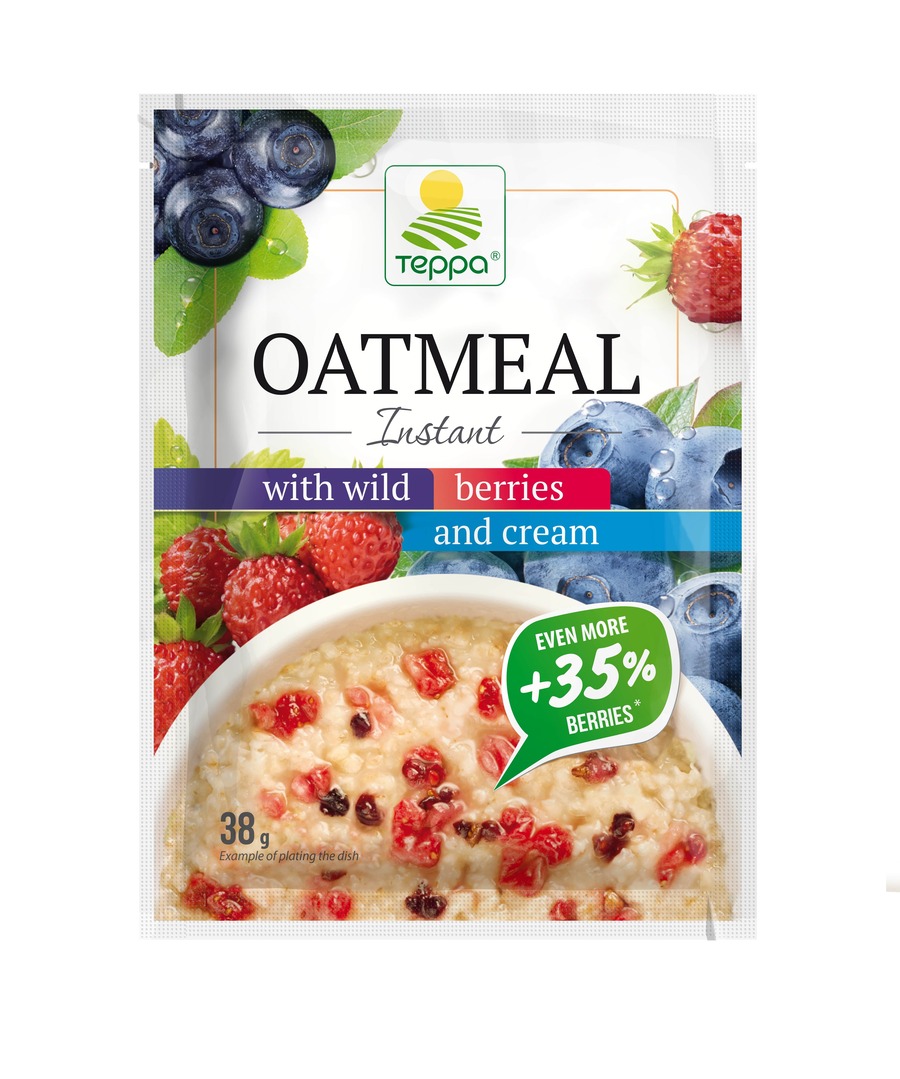 Instant oatmeal porridge with strawberries, blueberries, bilberries and cream